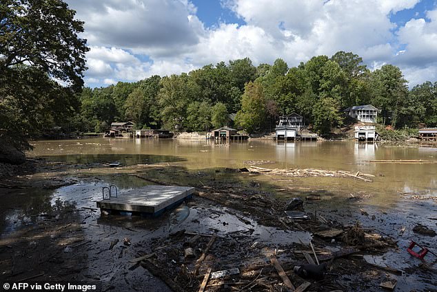 Milton is projected to bring a daunting 12 inches of rain that could inundate the already troubled region of Florida, where many are still recovering from intense flooding and winds that topped 140 mph. Pictured: Pieces of a destroyed dock are seen in Lake Lure, North Carolina, on October 2.