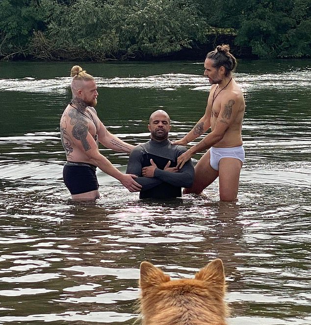 Russell Brand (right) performed a baptism wearing only boxers this week