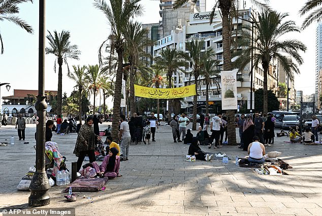 The Corniche Beirut promenade is crowded with people who have nowhere to go