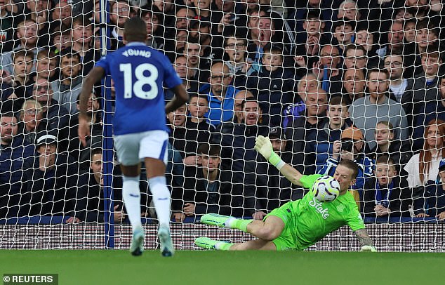 Jordan Pickford dives low to his left to deny his England team-mate at Goodison Park