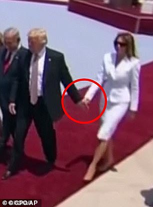 At the time, a video clearly showed Melania pushing Trump's hand away as she walked half a step behind him and Israeli Prime Minister Benjamin Netanyahu and his wife Sara.