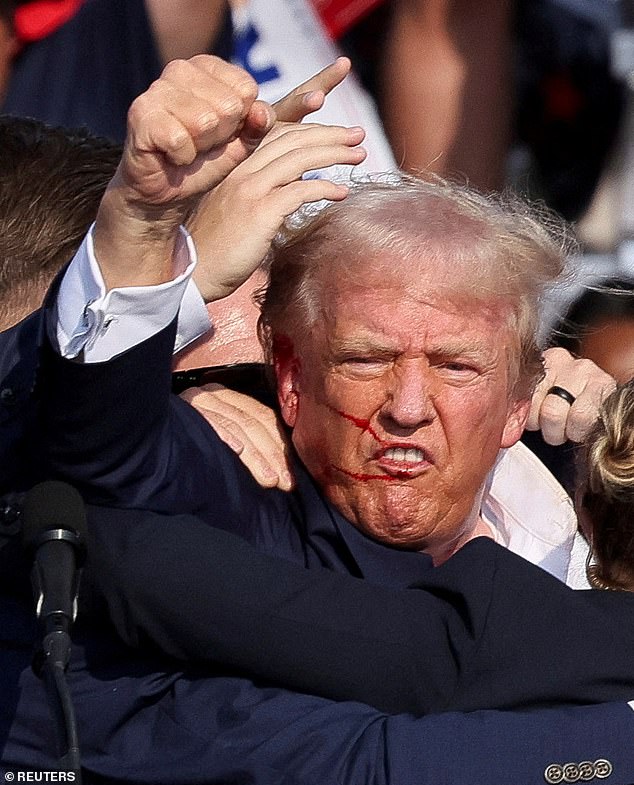 Trump, moments after 20-year-old Thomas Crooks cut off his ear during a rally on July 13.