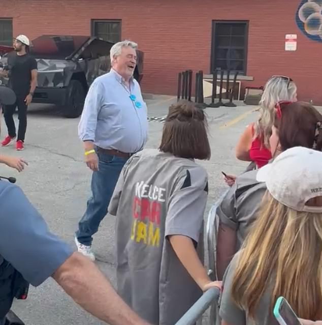 Ed Kelce arrived at Kelce Car Jam wearing a blue dress shirt and jeans on Travis' 35th birthday.