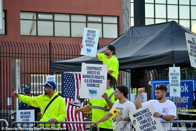 Longshoremen carry signs and demonstrate outside the Red Hook terminal in Brooklyn on Thursday.