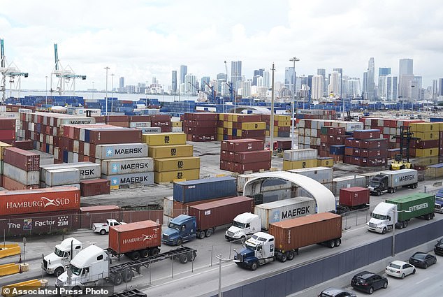 Trucks line up to enter Port Miami, after the union representing 45,000 striking dockworkers reached an agreement to suspend a three-day strike.