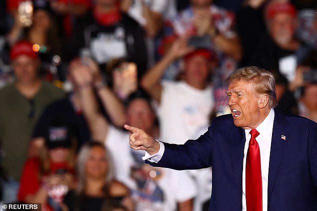 Republican presidential candidate and former US President Donald Trump gestures during a rally at the site of the July assassination attempt on him in Butler, Pennsylvania, the United States, on October 5, 2024.