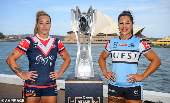 Sydney Roosters captain Isabelle Kelly and Cronulla Sharks captain Tiana Penitani pose for a photograph ahead of a 2024 NRLW Grand Final press conference at Circular Quay, Sydney, Friday 4 October 2024. The Sydney Roosters will take on the Cronulla Sharks in Sunday's 2024 NRLW Grand Final. (AAP Image/Dan Himbrechts) DO NOT ARCHIVE