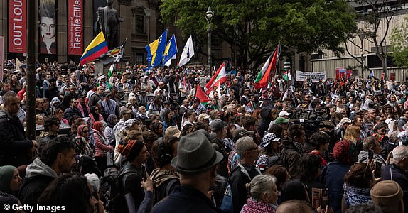 MELBOURNE, AUSTRALIA - OCTOBER 6: Palestine supporters gather at the State Library of Victoria for a protest organized to mark the anniversary of the Gaza war on October 6, 2024 in Melbourne, Australia. Organizers of the pro-Palestine protests in Sydney will go ahead with a demonstration on Sunday, October 6, despite legal attempts by police to ban gatherings due to safety concerns related to expected crowd sizes and potential disruption. The next day, a vigil is planned to honor victims of violence in Gaza, coinciding with the first anniversary of the Hamas attacks, which has drawn criticism from government officials who consider the timing "extremely provocative". Protesters also planned to gather for similar events in Melbourne. (Photo by Diego Fedele/Getty Images)