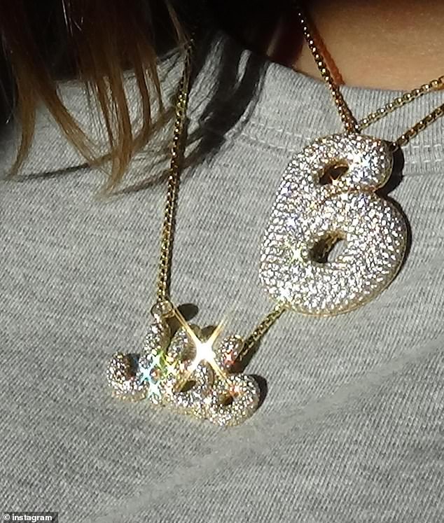 Justin's model wife, 27, recently showed off a diamond-encrusted necklace with her newborn's initials.