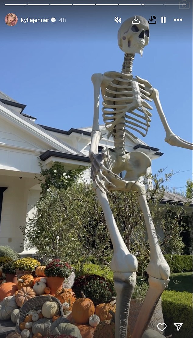 Jenner's adjacent mansion in Los Angeles was extravagantly decorated with a towering skeleton towering over his pumpkins and pumpkins.