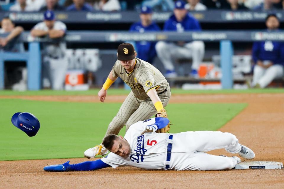 Dodgers baserunner Freddie Freeman clears the tag on San Diego second baseman Jake Cronenworth.