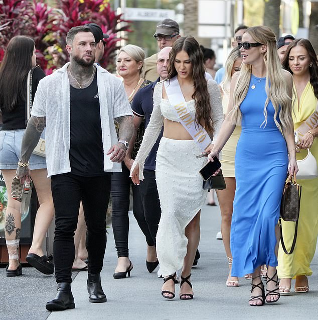 Completing her look with a chunky black heel, Jessika walked close to her brother and his partner, who announced their engagement in July 2021.