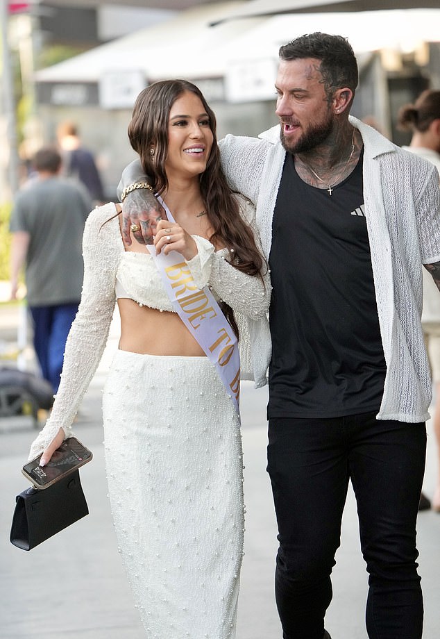 The brunette opted for traditional white to celebrate her upcoming nuptials, wearing a long-sleeved crop top and a long skirt.