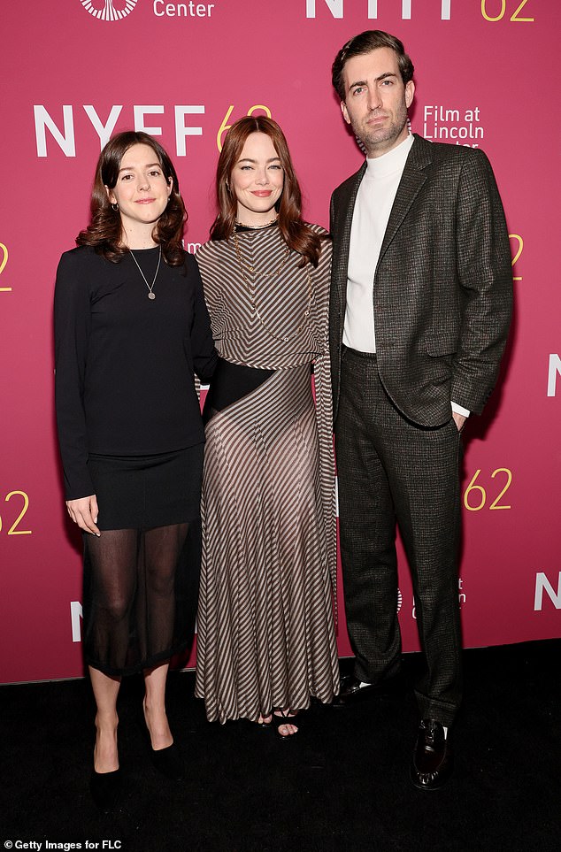 At the screening, she was joined by her husband, who looked dapper in a dark gray tweed suit paired with a white turtleneck. On the red carpet, the stylish couple posed for a photo alongside fellow co-producer Ali Herting.