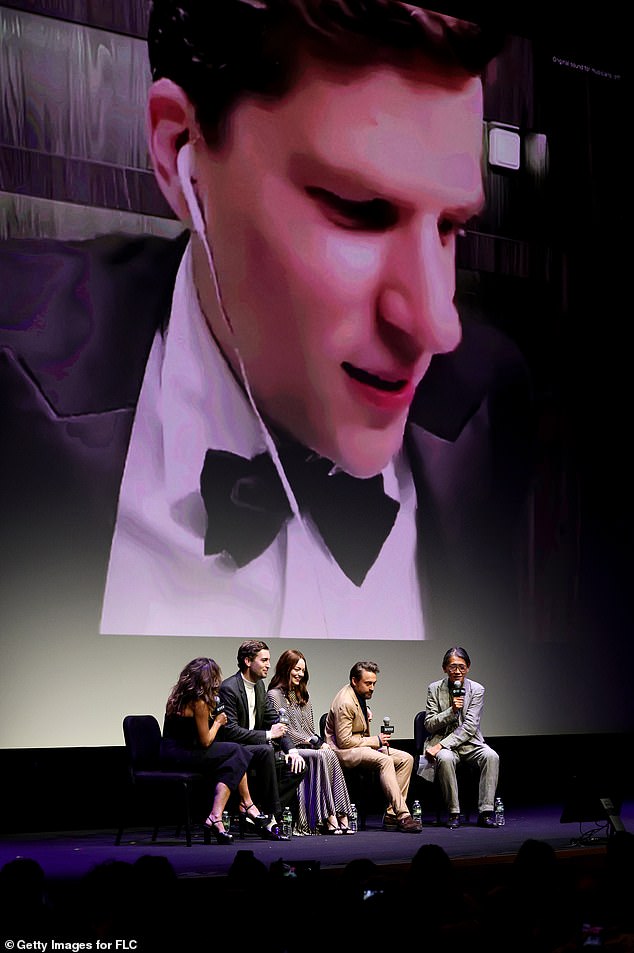 The group behind A Real Pain were talking to each other as Eisenberg joined them on screen, wearing a tuxedo and wired headphones.