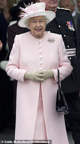 Queen Elizabeth donned a soft pink ensemble during her visit to Margate in November 2011.