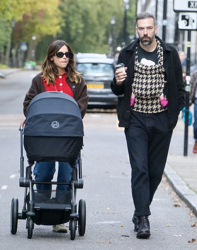 The director sipped his coffee as he chatted with Jenna, sporting an all-black ensemble of a jacket, jeans, and a plain t-shirt.