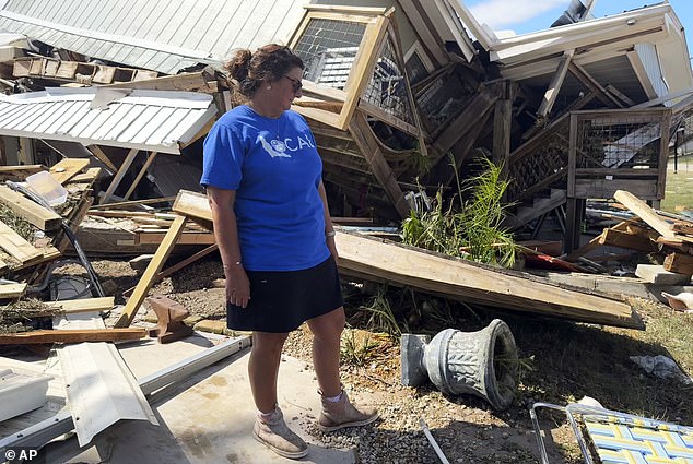 Laurie Lilliott stands in the rubble of her destroyed home in Dekle Beach, rural Taylor County, Florida, after Hurricane Helene.