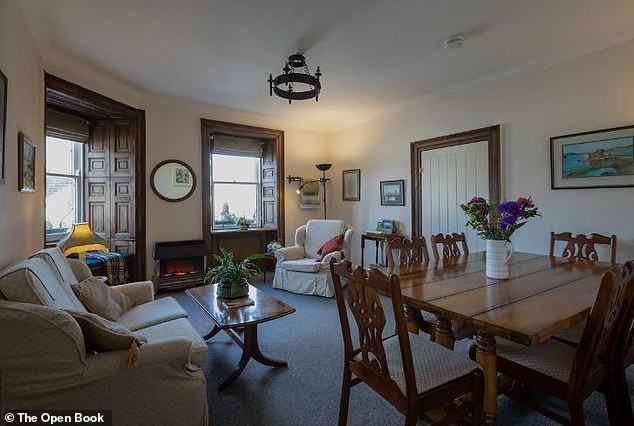 Pictured: the cozy dining room and living room that guests can enjoy after a hard day at work.