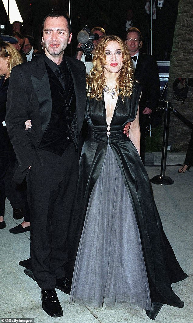 The two worked closely throughout the Queen of Pop's career, but had a falling out when he published an explosive book about her (pictured at Vanity Fair's 1998 Oscar party).