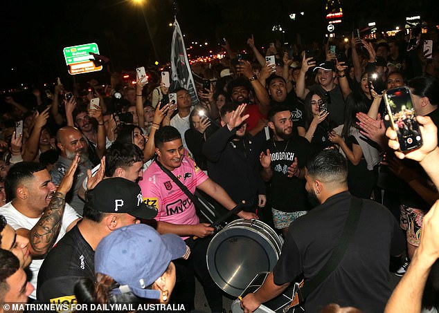 The man with the big drum kept the beat going as his fellow fans partied hard in Penrith.