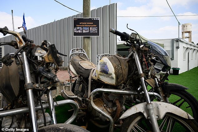 Recovered motorcycles used by Hamas members during the October 7 attacks are seen during an IDF exhibition.