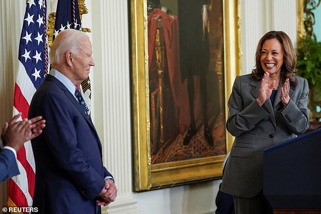 Vice President Democratic presidential candidate Kamala Harris applauds US President Joe Biden