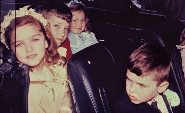 Madonna is seen going to her first communion in 1967 with her siblings Marty, Melanie and Christopher in front.