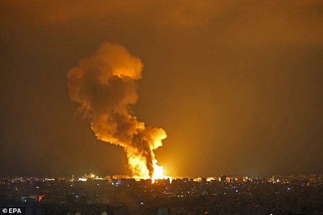 Smoke rises from a fire following an explosion following an Israeli attack in Beirut, Lebanon, early October 6.