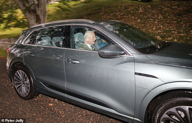 Charles smiled as he got behind the wheel during his visit to Crathie Kirk in Scotland this morning.