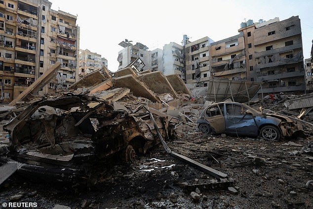 A view shows damaged buildings and vehicles following Israeli attacks in Beirut's southern suburbs, amid ongoing hostilities between Hezbollah and Israeli forces.