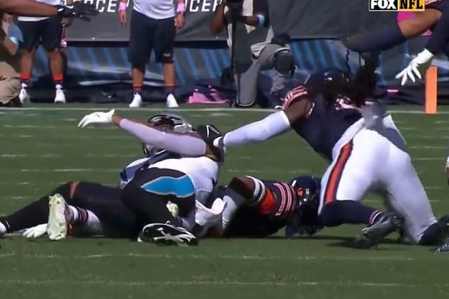 The tight end lay motionless after collapsing on top of his opponent following the terrifying blow.