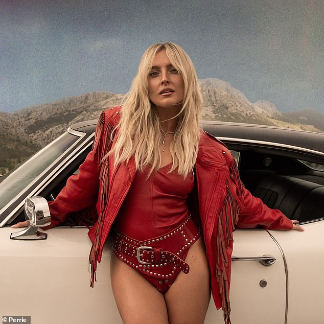 Perrie put on another daring display in a red leather outfit for the song's video.