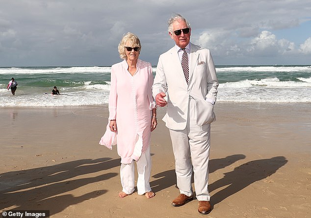 Prince Charles, Prince of Wales, and Camilla, Duchess of Cornwall, walk along Broadbeach on the Gold Coast, Australia, in April 2018.