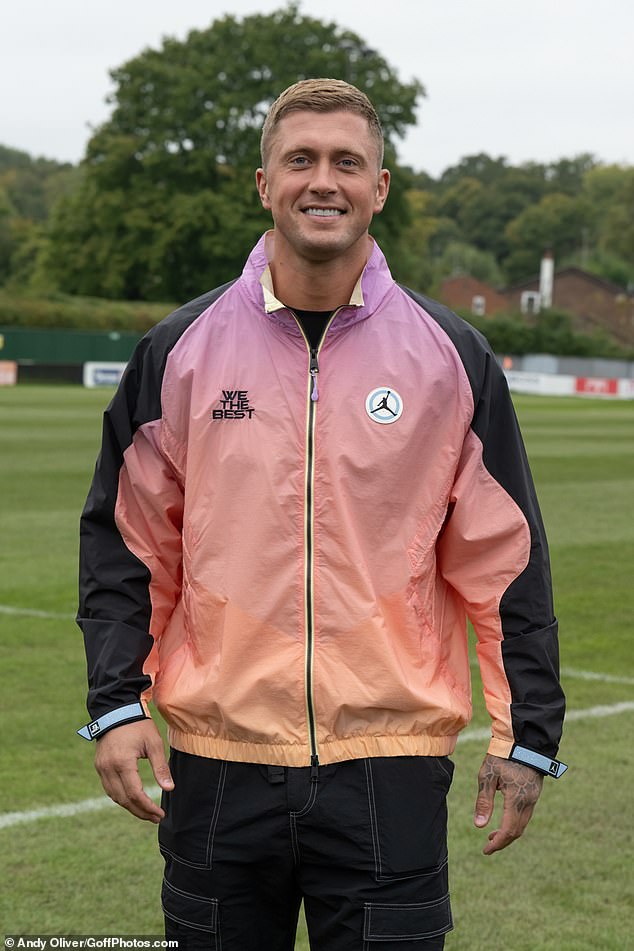 Dan Osborne was in a very good mood when he arrived at the football game.