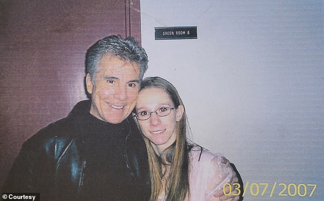 Mullenberg photographed with America's Most Wanted host John Walsh