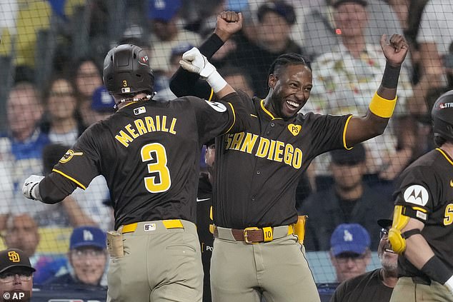 The San Diego star celebrates after Jackson Merrill extended his lead after the delay.