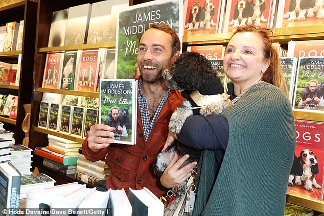 While signing copies of his book for elated visitors, James was able to meet several gorgeous dogs, including a therapy dog, with whom he took the time to have a photo taken.