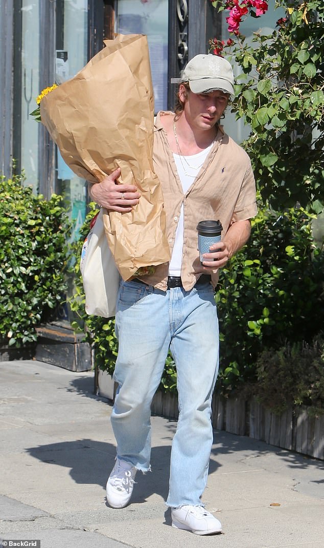 Finally, the New York City native bought a large bouquet of flowers.