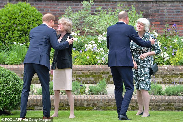 William and Harry hugging their aunts at the unveiling of their mother Princess Diana's statue at Kensington Palace in 2021.