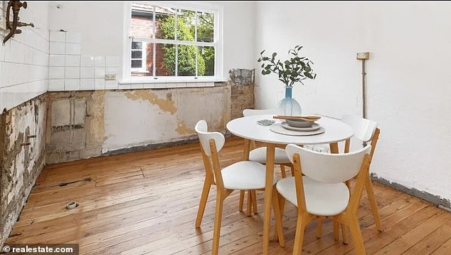 Australia's crazy property market has seen an apartment (pictured) without a kitchen get 14 registered bidders and sell for more than $3 million.