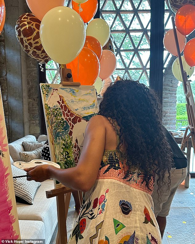 Continuing his love for giraffes, Vick was also seen enjoying a painting session, with the talented star creating a masterpiece starring the animal.