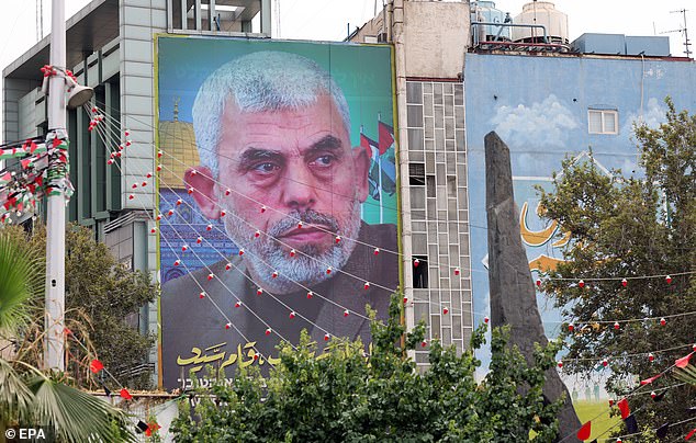 A poster of Hamas' new leader Yahya Al-Sinwar hangs on a wall in Palestine Square in Tehran, Iran, on August 12, 2024.