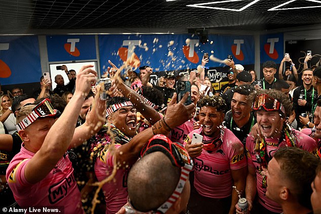 The Panthers celebrated in the locker room after beating the Melbourne Storm 14-6 at Accor Stadium in Sydney