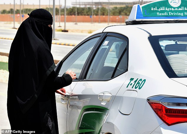 A Saudi woman preparing to start a driving lesson. Vision 2030 was launched in 2016 by MBS as part of an attempt to diversify the petrostate's economy and create a 