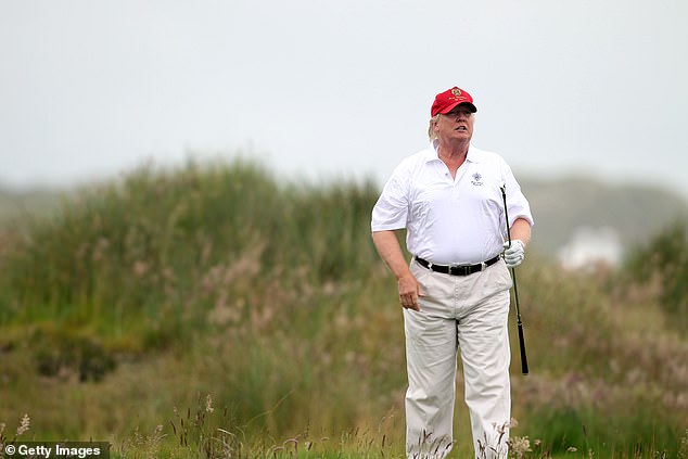 The 18-hole MacLeod course has been adjacent to the original golf course, which opened in 2012 after a long and controversial planning process (pictured: Donald Trump plays a round of golf after the opening of the Trump International course Golf Links on July 10, 2012)