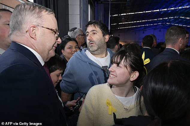 The Prime Minister received a warm welcome from some attending the Melbourne vigil.