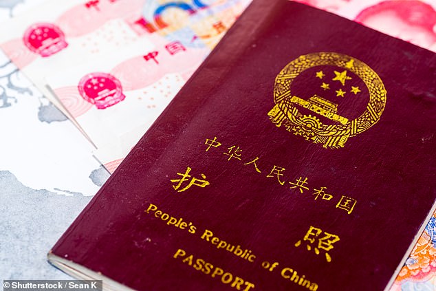 A Chinese passport. The number of public sector workers facing restrictions on their ability to travel abroad has greatly expanded this year to include most staff in schools, universities, local governments and other state-owned companies (file image)