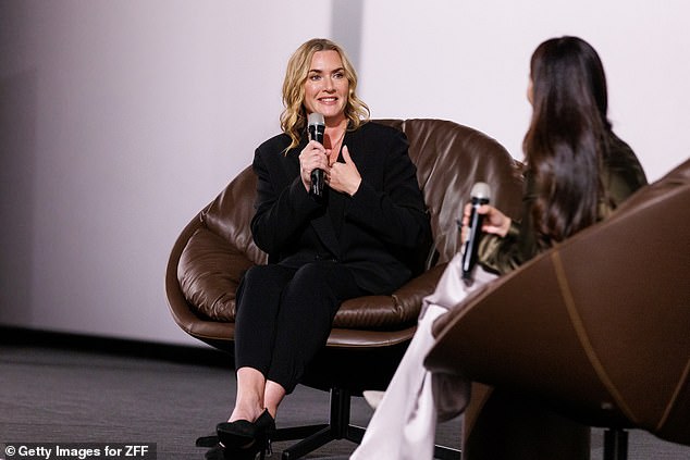 The Titanic star looked incredible in the black jacket and pants which she paired with a matching blouse and sky-high heels.