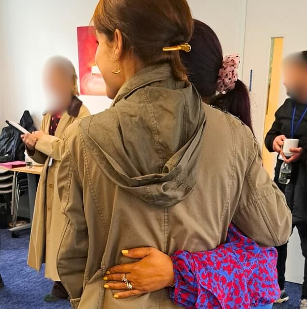 Eugenie wears a khaki bomber jacket with sequin embellishments on the shoulder and subtle pieces of gold jewelry while meeting survivors of modern slavery.